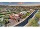 Aerial shot of a luxury home with a tile roof and golf course views in a desert landscape at 15106 E Miravista --, Fountain Hills, AZ 85268
