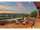 Backyard patio with view of mountains and golf course, with stone wall, furniture and desert plants at 15106 E Miravista --, Fountain Hills, AZ 85268