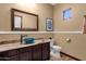 Bathroom featuring a vanity with a unique blue bowl sink, warm lighting, and neutral-toned walls at 15106 E Miravista --, Fountain Hills, AZ 85268