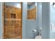 Shower features decorative tile work, a built-in niche, shower head, and pebble floor at 15106 E Miravista --, Fountain Hills, AZ 85268