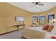 Bedroom showcases a window seat with scenic views, soft carpet, and a decorative ceiling fan at 15106 E Miravista --, Fountain Hills, AZ 85268