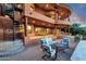 Spacious covered patio with spiral staircase, elegant seating, and serene ambiance at 15106 E Miravista --, Fountain Hills, AZ 85268