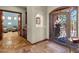 Elegant foyer with tile flooring, decorative iron door, and an open view to other rooms at 15106 E Miravista --, Fountain Hills, AZ 85268