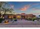 Stunning home exterior featuring a circular design, stone accents, and desert landscaping at 15106 E Miravista --, Fountain Hills, AZ 85268