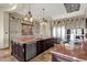 Spacious gourmet kitchen featuring double islands, stone counter tops, stainless steel appliances, and custom cabinets at 15106 E Miravista --, Fountain Hills, AZ 85268