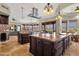 Large open kitchen with double islands, stainless steel appliances, and travertine floors at 15106 E Miravista --, Fountain Hills, AZ 85268