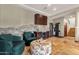 A lounge area offers comfortable seating, a wine fridge, and a home gym, all with beautiful travertine flooring at 15106 E Miravista --, Fountain Hills, AZ 85268