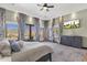 Bedroom with large windows offering scenic views, elegant curtains, and a cozy atmosphere at 15106 E Miravista --, Fountain Hills, AZ 85268
