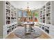 Home office with built-in bookshelves, a chandelier, and windows providing natural light at 15106 E Miravista --, Fountain Hills, AZ 85268
