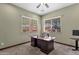 Well-lit office with neutral walls, large windows with wood blinds, and a spacious, dark wood desk at 15106 E Miravista --, Fountain Hills, AZ 85268