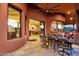 Covered outdoor patio featuring an outdoor dining space with seamless access to indoor dining and living area at 15106 E Miravista --, Fountain Hills, AZ 85268