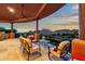 Expansive covered patio with a comfortable outdoor seating area and incredible sunset views at 15106 E Miravista --, Fountain Hills, AZ 85268