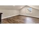 Finished attic featuring hardwood floors and a window at 1533 W Culver St, Phoenix, AZ 85007