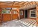Charming backyard patio with brick columns, wooden pergola, and secure fence at 1533 W Culver St, Phoenix, AZ 85007