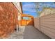 This brick home has a wood pergola covered patio and gated access to the side yard at 1533 W Culver St, Phoenix, AZ 85007