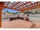 The covered patio features a pizza oven, stainless steel grill, and lots of countertop space at 1533 W Culver St, Phoenix, AZ 85007