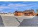 Full backyard view featuring pergola covered patio, pizza oven, gravel ground cover and fenced yard at 1533 W Culver St, Phoenix, AZ 85007