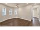 Bright bedroom featuring hardwood floors, neutral paint, and natural light from three windows at 1533 W Culver St, Phoenix, AZ 85007