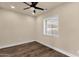 Bright bedroom with hardwood floors, neutral paint, and natural light from single window at 1533 W Culver St, Phoenix, AZ 85007