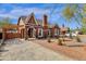 Charming brick home with a manicured front yard, water fountain, and welcoming entrance at 1533 W Culver St, Phoenix, AZ 85007