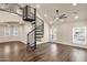 Open-concept living space featuring a spiral staircase, large windows, and ample natural light at 1533 W Culver St, Phoenix, AZ 85007