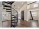 Unique living space with a spiral staircase and large windows at 1533 W Culver St, Phoenix, AZ 85007