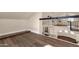 Spacious loft area overlooking the kitchen, featuring modern railings and hardwood floors at 1533 W Culver St, Phoenix, AZ 85007