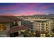 Stunning aerial view of the community at sunset with mountain backdrop at 15802 N 71St St # 754, Scottsdale, AZ 85254