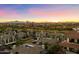 Aerial view of residential area and golf course showcasing a tranquil setting with mountain views at 15802 N 71St St # 754, Scottsdale, AZ 85254