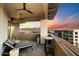 Relaxing balcony with comfortable seating and panoramic views of the city skyline and mountains at sunset at 15802 N 71St St # 754, Scottsdale, AZ 85254