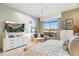 Bright bedroom featuring modern decor, comfortable seating, and picturesque mountain views through a large window at 15802 N 71St St # 754, Scottsdale, AZ 85254