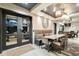 Open dining area with seating, an oversized clock, and a large door at 15802 N 71St St # 754, Scottsdale, AZ 85254