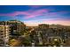 Street view showcases urban apartments under a striking sunset sky at 15802 N 71St St # 754, Scottsdale, AZ 85254