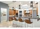 Open kitchen features a large island with bar seating, stainless steel appliances, and a modern aesthetic at 15802 N 71St St # 754, Scottsdale, AZ 85254