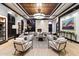 Elegant living room features a coffered ceiling, modern fireplace, and sophisticated decor at 15802 N 71St St # 754, Scottsdale, AZ 85254
