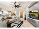 Bright living room with a sleek entertainment setup, plush seating, and open access to the kitchen at 15802 N 71St St # 754, Scottsdale, AZ 85254