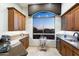 Attractive wet bar featuring granite counters and city view at 15802 N 71St St # 754, Scottsdale, AZ 85254