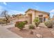 Lovely home featuring mature landscaping, desert rock, and a spacious three-car garage at 16044 S 24Th Pl, Phoenix, AZ 85048