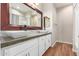 Stylish bathroom boasts double vessel sinks, concrete countertops, and modern fixtures at 16658 W Mescal St, Surprise, AZ 85388