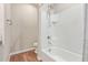 Bright bathroom featuring a tiled shower and tub with modern fixtures and hardware at 16658 W Mescal St, Surprise, AZ 85388