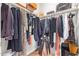 Walk-in closet with organized storage solutions and hanging rods for ample space at 16658 W Mescal St, Surprise, AZ 85388