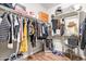 Walk-in closet with clothing, shelving, and mirror at 16658 W Mescal St, Surprise, AZ 85388