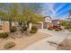 Beautiful two-story home with desert landscaping, a two-car garage, and a well-maintained front yard at 16658 W Mescal St, Surprise, AZ 85388