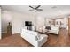 Spacious living room featuring hardwood floors, modern furniture, and an open layout to the kitchen at 16658 W Mescal St, Surprise, AZ 85388