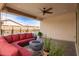 Covered patio with a fire pit and seating area overlooking the pool and yard at 16658 W Mescal St, Surprise, AZ 85388