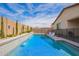 The backyard boasts a sparkling pool with water feature and privacy landscaping at 16658 W Mescal St, Surprise, AZ 85388