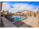 Fenced in pool offers privacy and safety to enjoy outdoor living at 16658 W Mescal St, Surprise, AZ 85388