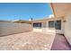 Enclosed brick-paved backyard featuring desert landscaping and space for outdoor entertaining at 17022 N Pinion Ln, Sun City, AZ 85373
