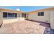 Private brick-paved backyard with stucco walls and desert landscaping, perfect for outdoor living at 17022 N Pinion Ln, Sun City, AZ 85373