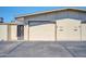 A well-maintained garage with parking spaces, showing the exterior of the property at 17022 N Pinion Ln, Sun City, AZ 85373